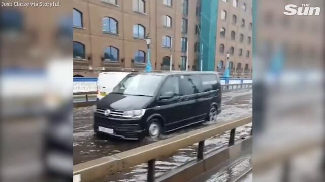 Tower Bridge flooded & Tube stations underwater as torrential rain hits London in severe UK weather