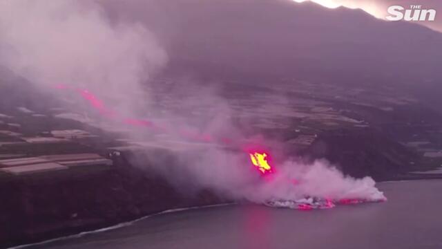 Spectacular drone footage captures lava from La Palma volcano crashing into ocean