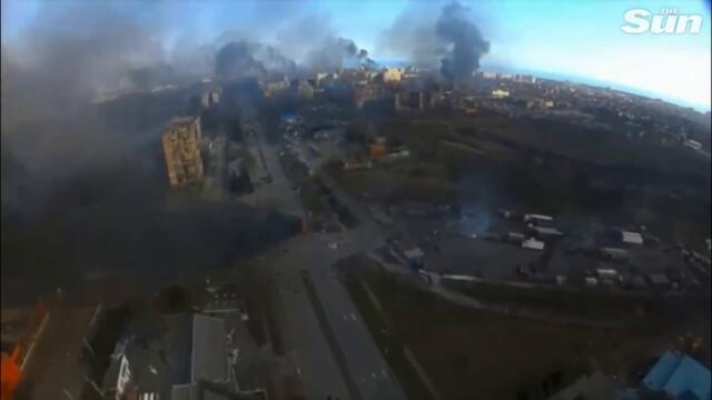 Russian attack on residential building in Mariupol, Ukraine, captured by drone