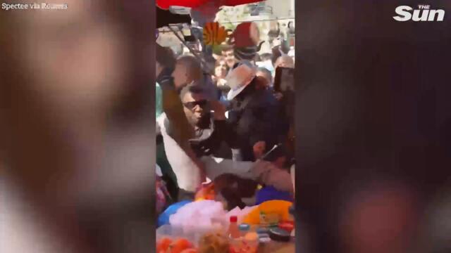 France's Macron pelted by tomato during market frenzy