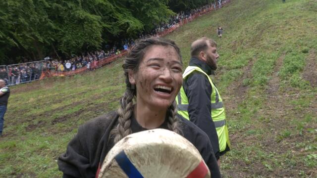 US woman rolls her way to victory in BRUTAL cheese rolling contest in the UK
