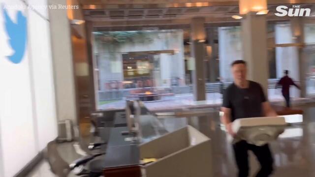 Elon Musk carries a SINK into Twitter headquarters after CEO hit deadline to complete $44b takeover