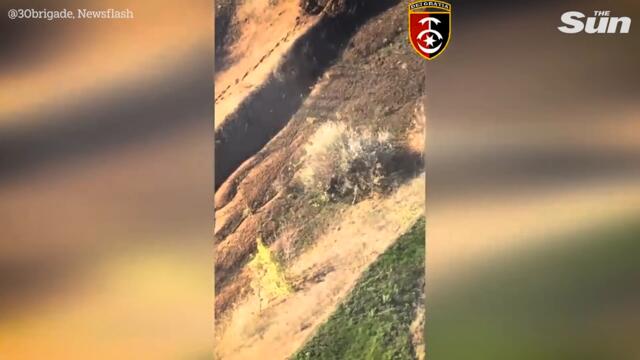 Ukrainian troops drop bombs on Russian forces with drones