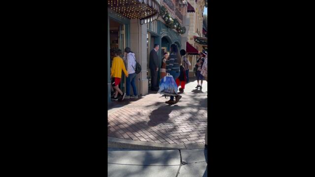 Mickey Mouse meets a guest that resembles Walt Disney on Dapper Day 2022