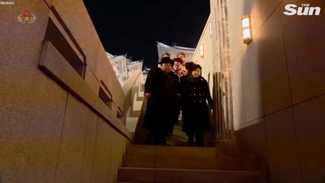 North Korea's Kim Jong-un shares spotlight with daughter at nuclear missile parade