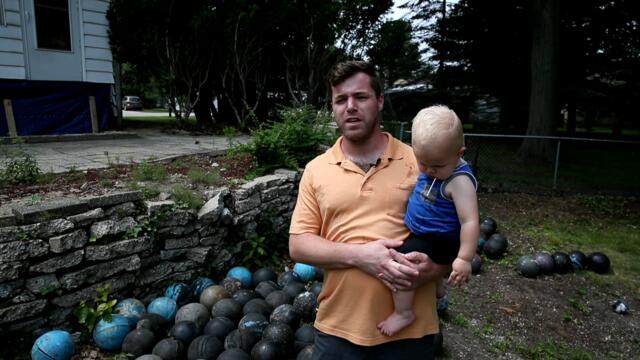 Man discovers 158 Brunswick bowling balls buried behind his home