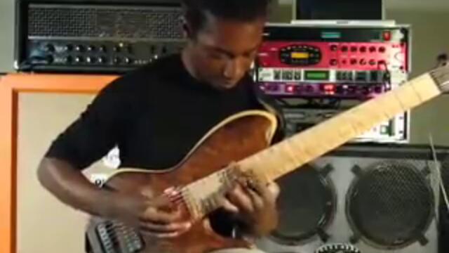 Tosin Abasi playing custom 8 string guitar