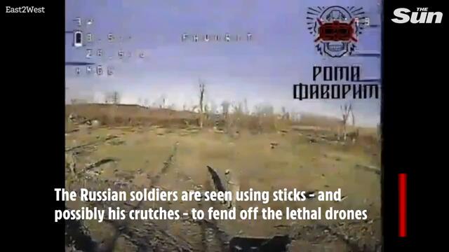 Russian soldier forced to fight on crutches tries to fend off drone