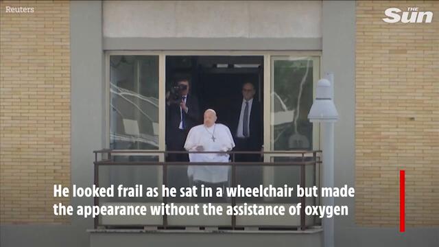 Frail Pope Francis waves from hospital window as he returns to Vatican